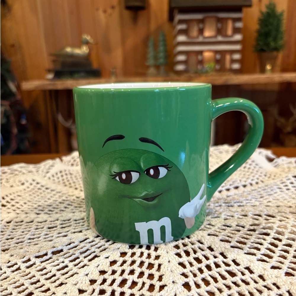 M&M's Green Coffee Mug featuring the phrase "Eat Your Heart Out, Darling!"